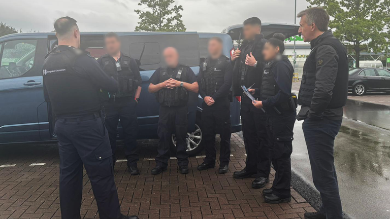 Security minister Dan Jarvis (far right) with the police ahead of the raids. Pic: Home Office