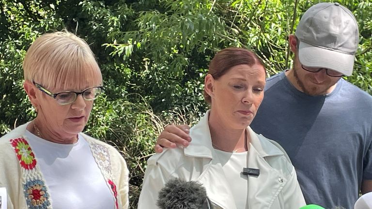 Ms Coulson's mother Lynne Sparkes (left) and her twin sister Kirsten Coulson (centre). Pic: PA
