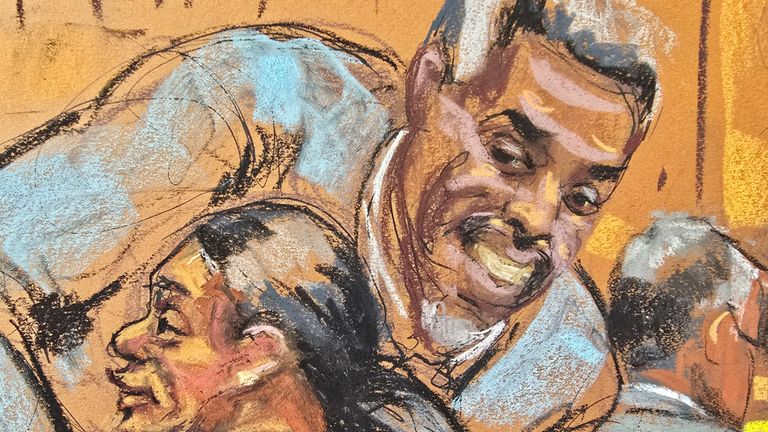 Sean "Diddy" Combs hugs his lawyer Nicole Westmoreland as he enters the courtroom during his sex trafficking trial
