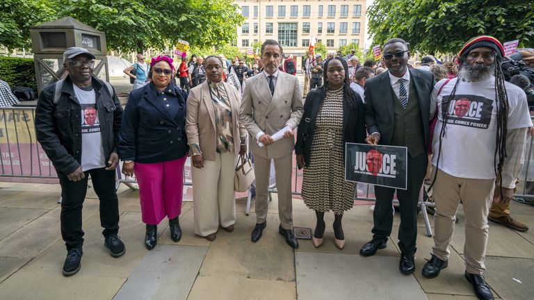 Solicitor Aamer Anwar alongside Sheku Bayoh sisters and supporters outside Capital House in Edinburgh, ahead of a two-day hearing focusing