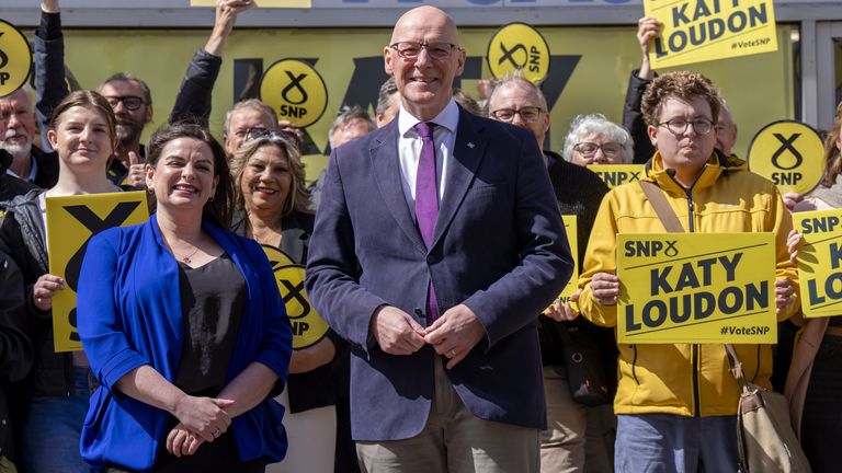 SNP Leader John Swinney joins parliamentary candidate Katy Loudon and party activists outside the party's campaign office in Hamilton, Lanar