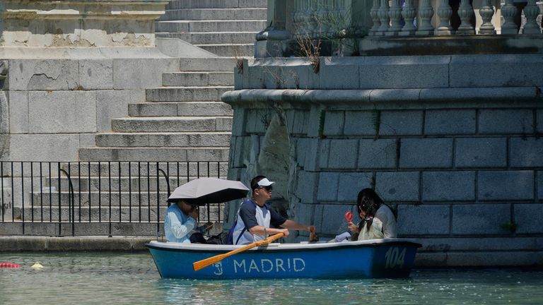 Tourists in Retiro Park in Madrid on Saturday. Pic: AP