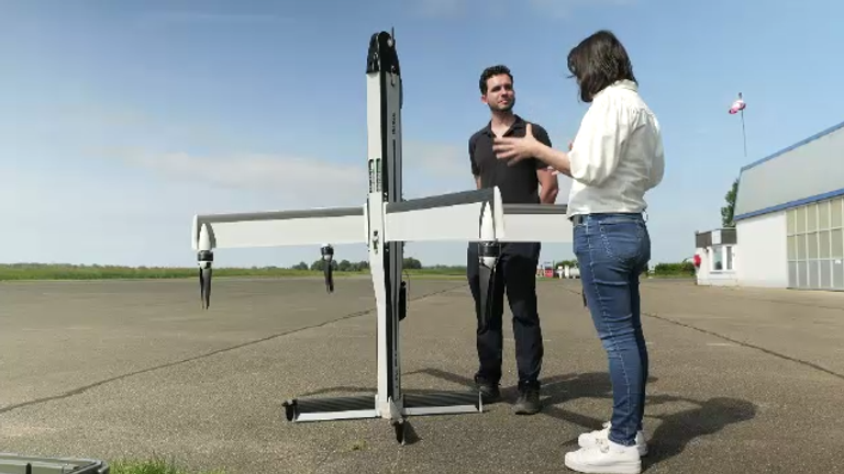 Siobhan Robbins with a STARK drone and a drone pilot