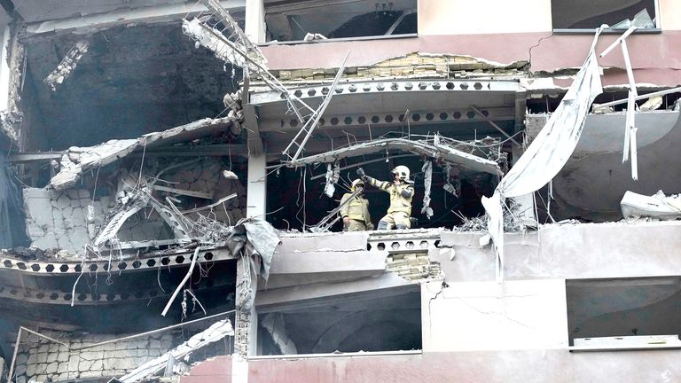Firefighters work the scene of an explosion at a residence compound in northern Tehran, Iran.
Pic: AP