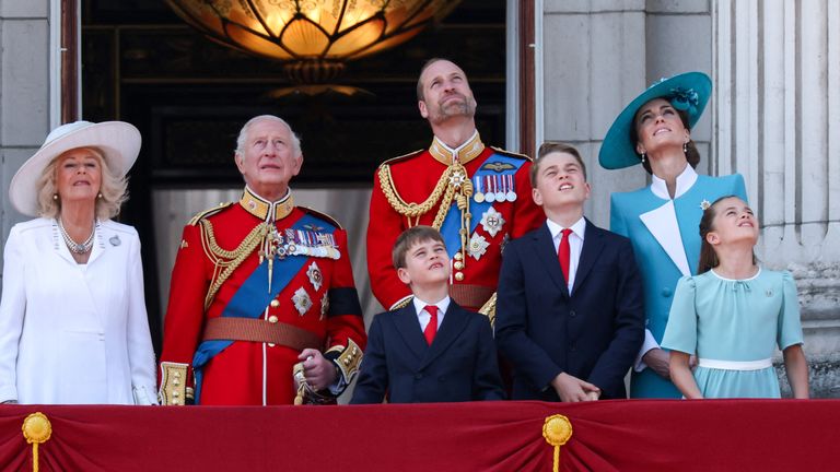 Royals on the balcony watch the Red Arrows flybye. Pic: Reuters