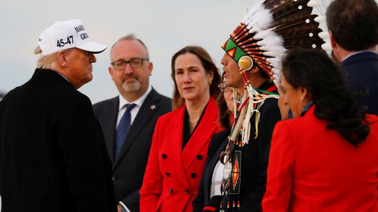 Mr Trump was greeted by Chief Steven Crowchild, when he flew into Calgary earlier. Pic: Reuters