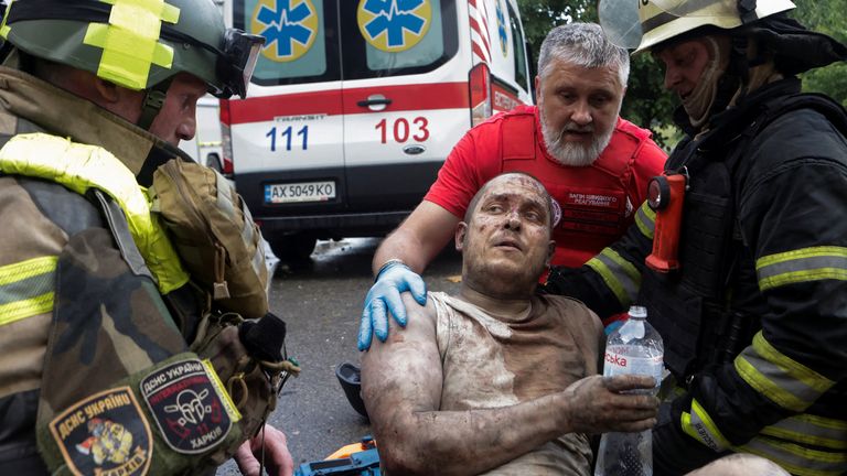 An injured resident is taken away by paramedics after being rescued in Kharkiv following a Russian attack.
Pic: Reuters/Sofiia Gatilova