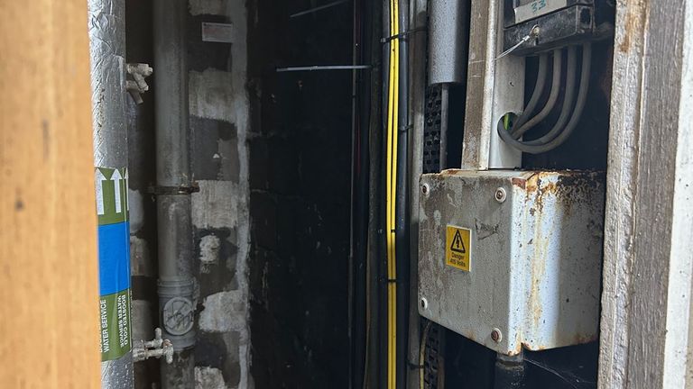 Pictures of the riser we saw with water damage around electrical equipment, including a ‘Danger high voltage’ labelled box 
