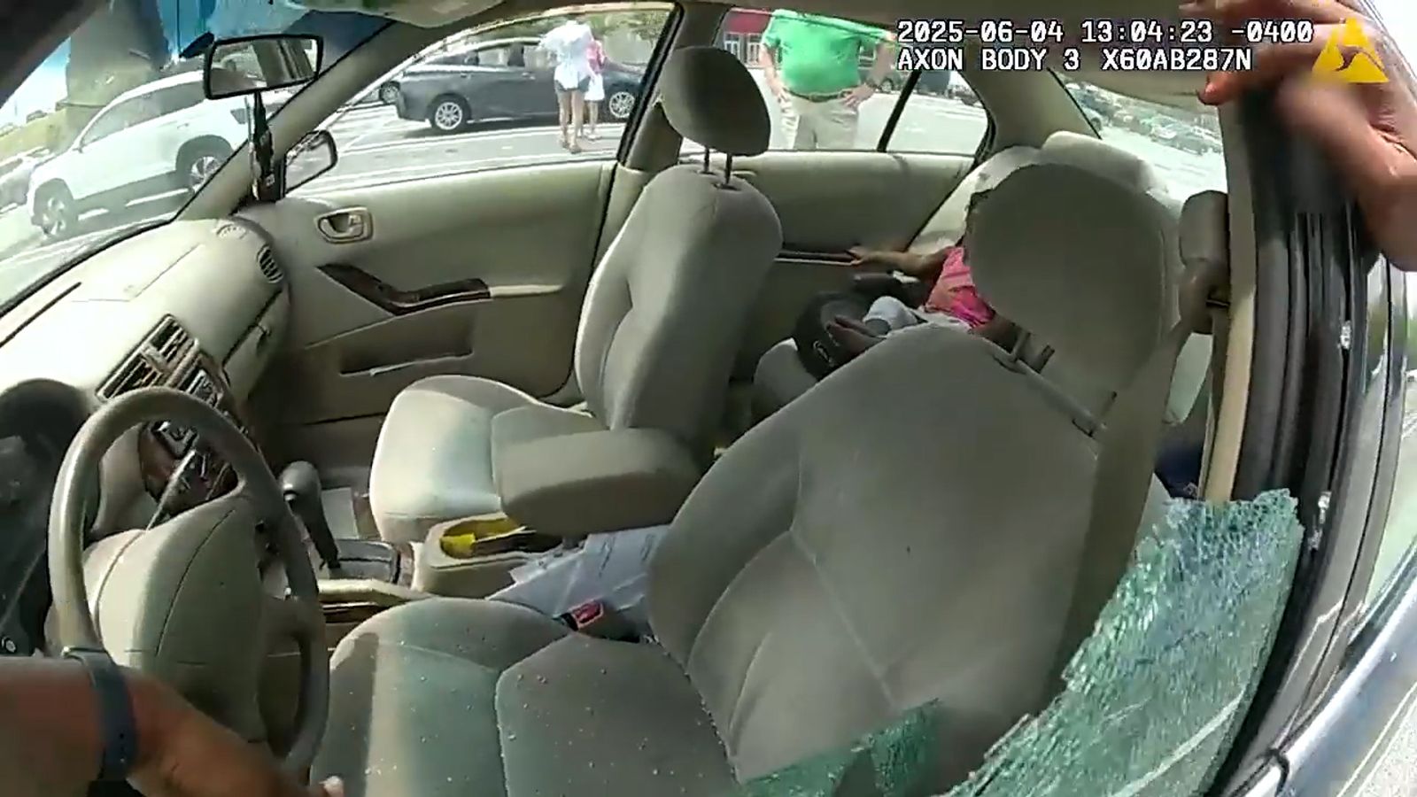 Police smash window to rescue two children from hot car | US News | Sky ...