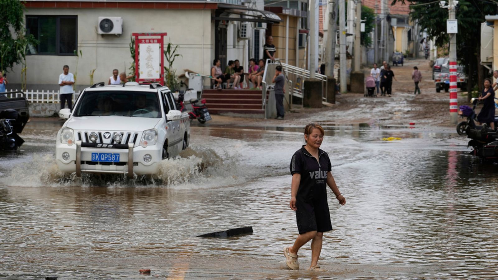China floods: At least 30 killed in Beijing and 80,000 evacuated