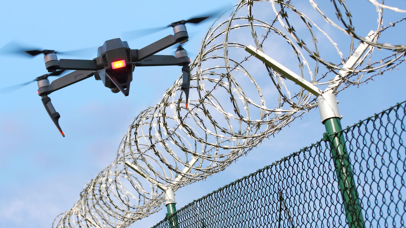 Drones are sending 'overwhelming amounts' of drugs into prisons - and could help inmates escape, report warns 