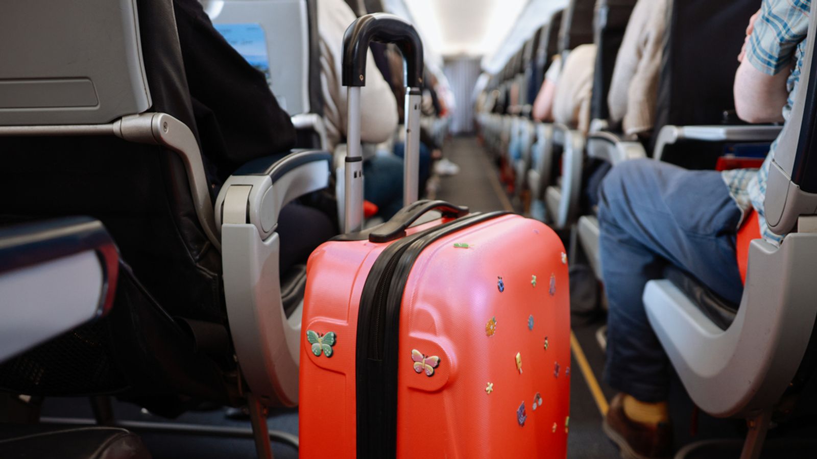 Money blog: UK airport staff 'get cash bonuses' for finding oversized baggage; Tesla shares plunge