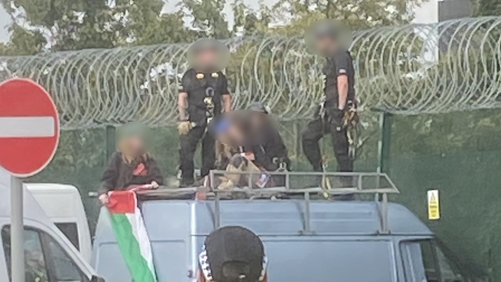 Three women charged under Terrorism Act after van driven into fence of defence factory