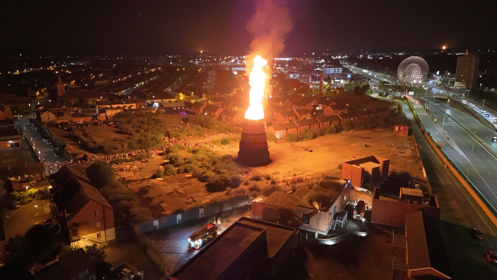 Eleventh night bonfire lit on asbestos site criticised as firefighters face ‘challenging’ conditions