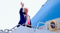 Donald Trump waves as he boards Air Force One.
Pic: Reuters