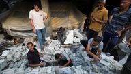 Palestinians search for casualties at the site of an overnight Israeli strike on a house, in Gaza City. Pic: Reuters