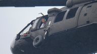 An official looks out a helicopter while flying over Camp Mystic along the banks of the Guadalupe River.
Pic: AP
