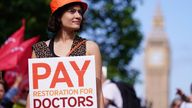 File photo dated 27/06/24 of a junior doctor on the picket line outside St Thomas' Hospital, London