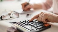 A pensioner is pictured using a calculator. Pic: iStock