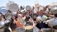 Palestinians wait for food in Gaza City. Pic: AP