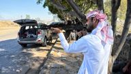 A fighter aims a gun