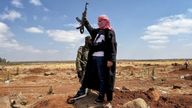 A fighter raises his gun near the city of Sweida amid a fragile ceasefire
Pic: Chris Cunningham