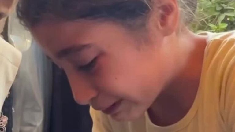 Footage shows young girl in Gaza mourning family.
