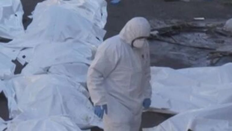Doctors pile body bags outside a hospital in Sweida, Syria.