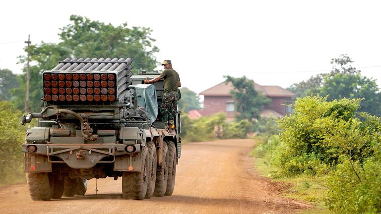 A Cambodian soldier patrols around 20 miles from the Ta Moan Thom temple where unrest with Thailand started. Pic: Reuters