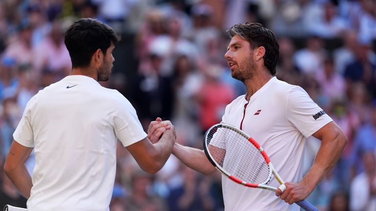 Cameron Norrie (right) following defeat to Carlos Alcaraz on day nine of Wimbledon