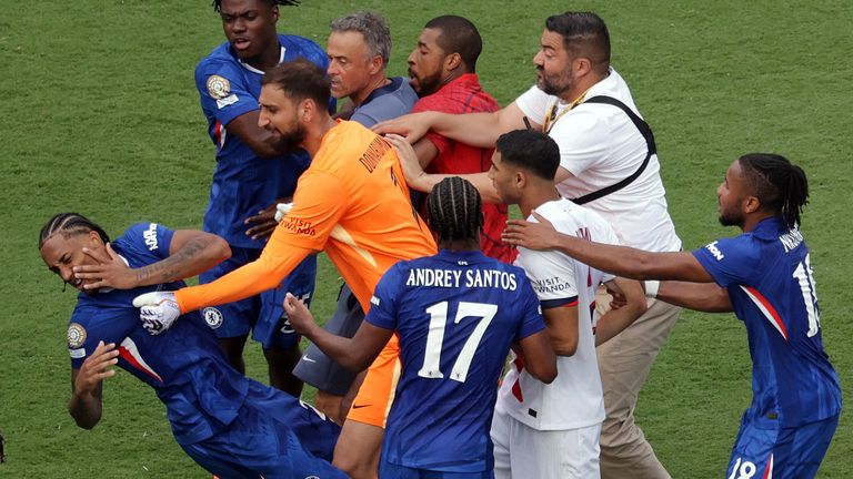 Joao Pedro falls to the ground clutching his face. Pic: Reuters