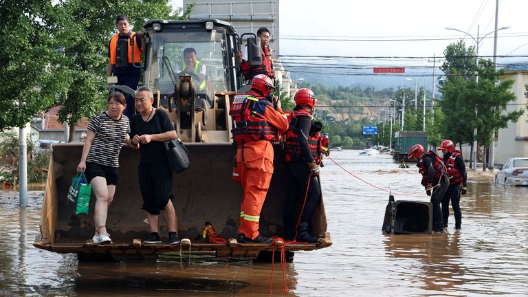 Rescue workers in Miyun. Pic: Reuters