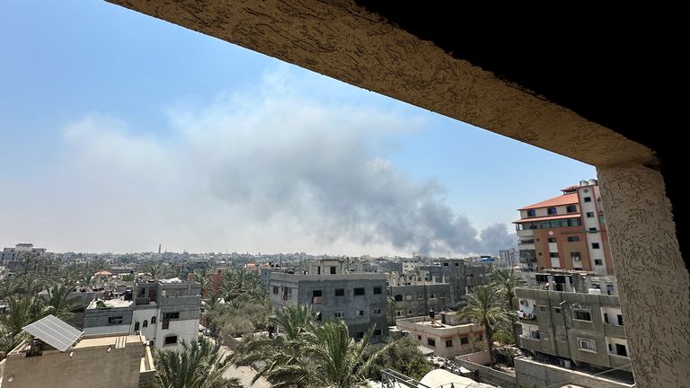 Smoke rises during Israeli strikes amid the Israeli military operation in Deir Al-Balah.
Pic: Reuters