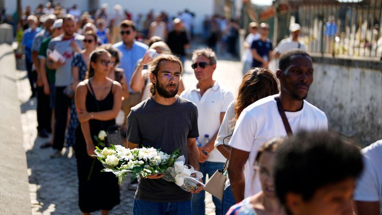 People line up as they wait to enter at a church where the bodies of Liverpool forward Diogo Jota and his brother Andr.. Silva have been brought for a wake and funeral in Gondomar, near Porto, Portugal, on Friday, July 4, 2025. (AP Photo/Manu Fernandez)