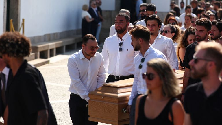 Pallbearers carry the coffins of Liverpool's Portuguese soccer player Diogo Jota and his brother Andre Silva, who died in a car crash near Z
