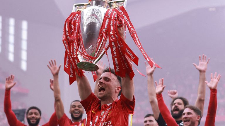 Diogo Jota holds the Premier League trophy aloft after the club's title win in the 2024/25 season. Pic: Reuters