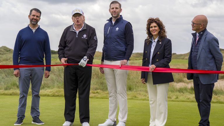US President Donald Trump cuts the ribbon to officially open the New Course, the second championship course at Trump International Golf Link
