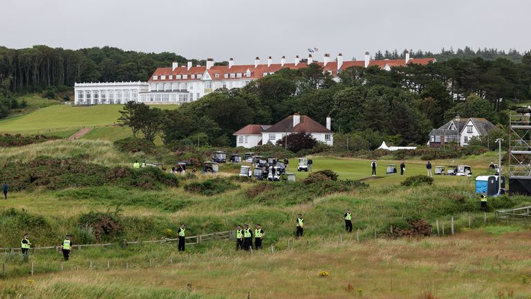 Police officers surround the area where US President Donald Trump plays golf at his Trump Turnberry golf course in South Ayrshire, as he beg