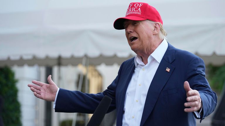 Donald Trump speaks to the media before walking across the South Lawn of the White House to board Marine One.
Pic AP