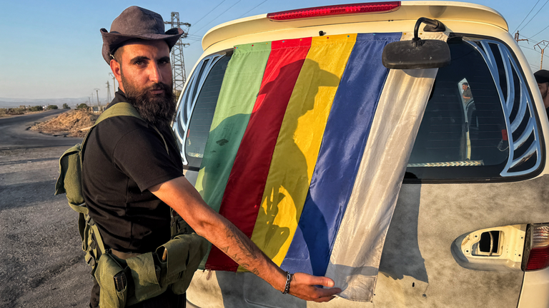 Druze fighter with flag