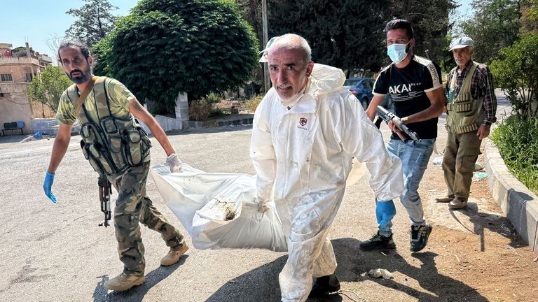 A body being carried outside the hospital