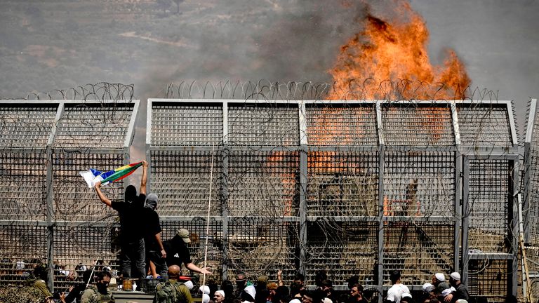 Druze from Syria and Israel protest on the Israeli-Syrian border, in Majdal Shams in the Israeli-controlled Golan Heights.
Pic: AP