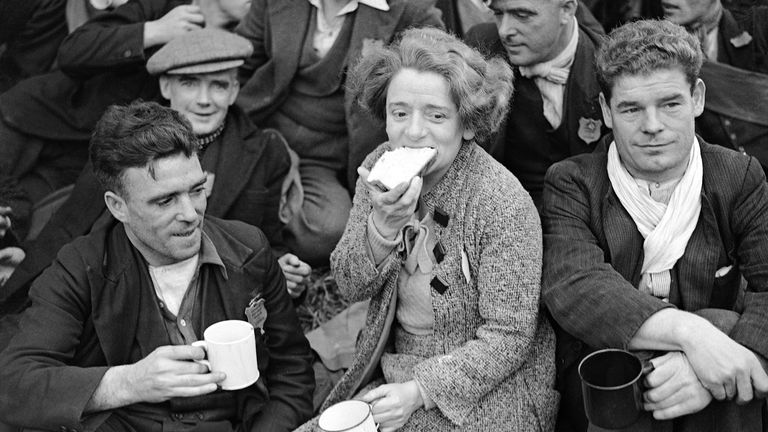 Ellen Wilkinson sits with the Jarrow marchers who walked from St Albans on 30 October 1936. Pic: AP