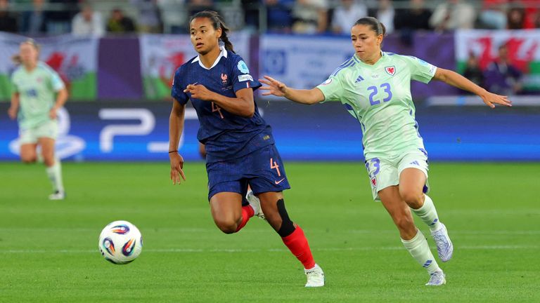 France's Alice Sombath in action with Wales' Ffion Morgan.
Pic: Reuters