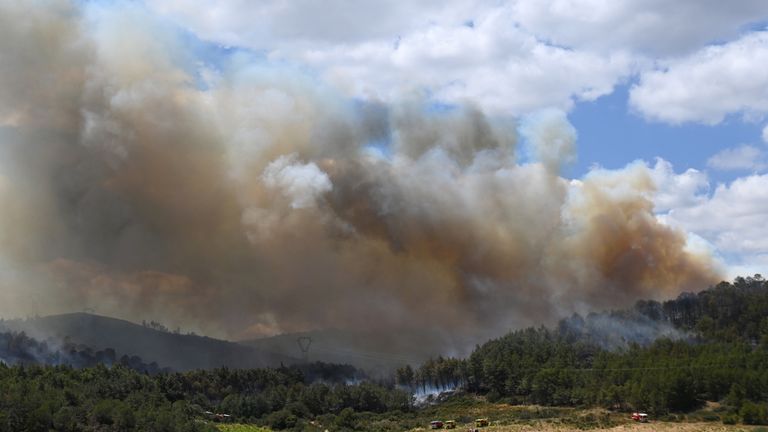 French firefighters work to contain a fire as wildfires continue to spread near Narbonne in Aude department in southern France.
Pic: Reuters