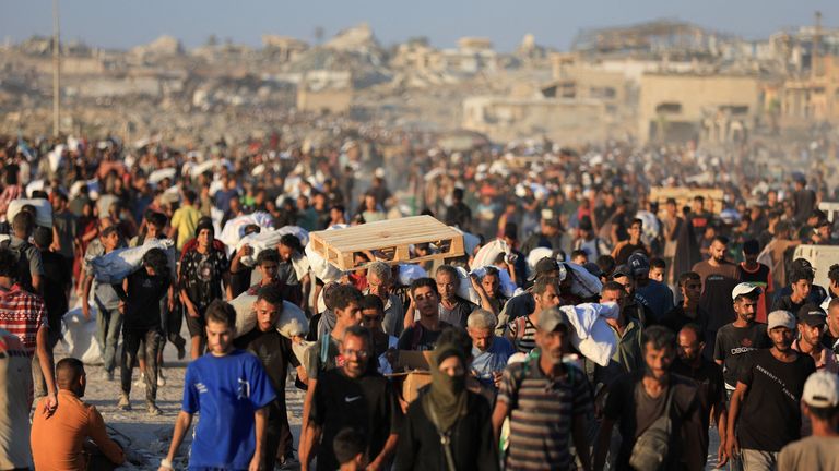 Palestinians carry aid supplies that entered Gaza through Israel, in Beit Lahia in the northern Gaza Strip.
Pic Reuters
