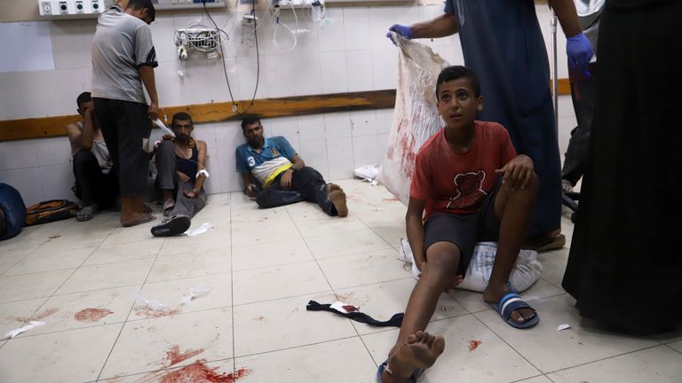 Palestinians are brought to Nasser Hospital after being shot by Israeli forces while gathering to receive bags of flour from aid trucks, according to hospital officials and eyewitnesses, in Khan Younis, Gaza Strip, on Thursday, July 24, 2025. (AP Photo/Mariam Dagga)