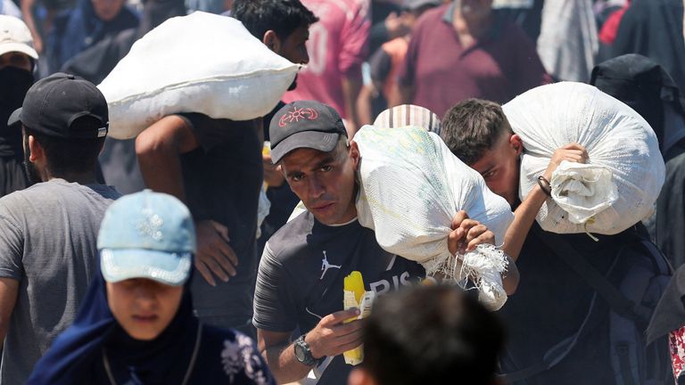Palestinians gather as they seek aid supplies from the U.S.-backed Gaza Humanitarian Foundation near Rafah.
Pic: Reuters