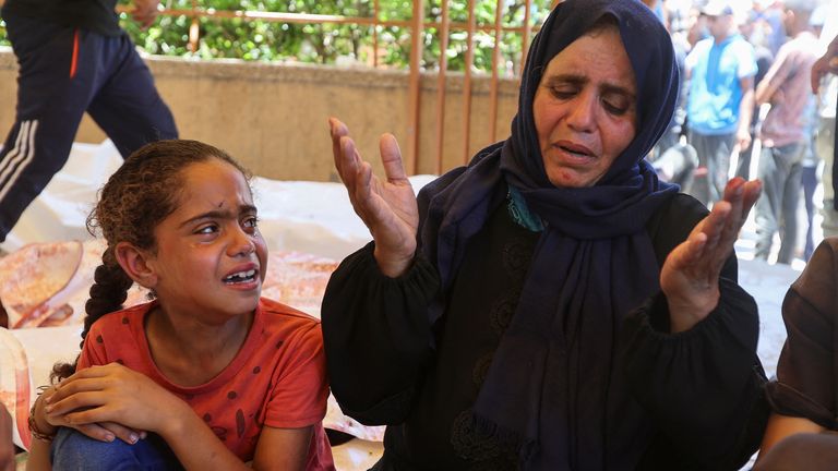 Somia Alshaar, pictured with her daughter, says her son was shot dead. Pic: Reuters