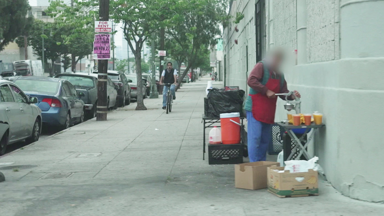 Man selling fruit on a street in LA